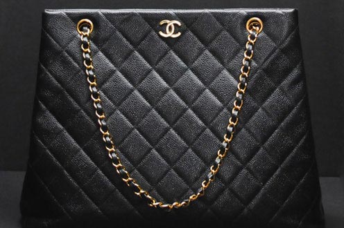 Black Chanel designer handbag you can loan or sell for cash